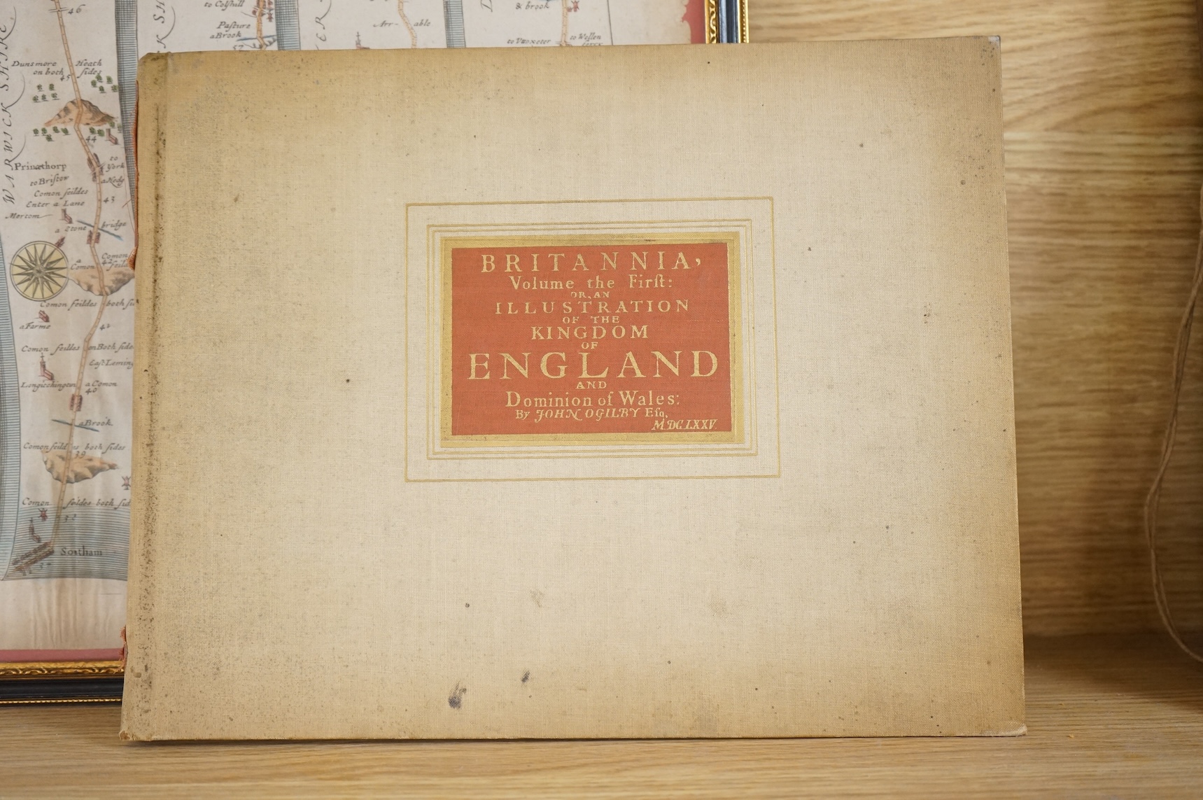 John Ogilby (1600-1676), hand coloured engraved road map, ‘Oxford to Coventry’ together with Britannia, volume the first or an illustration of the Kingdom of England and Dominion of Wales' by John Ogilby, hardback book,